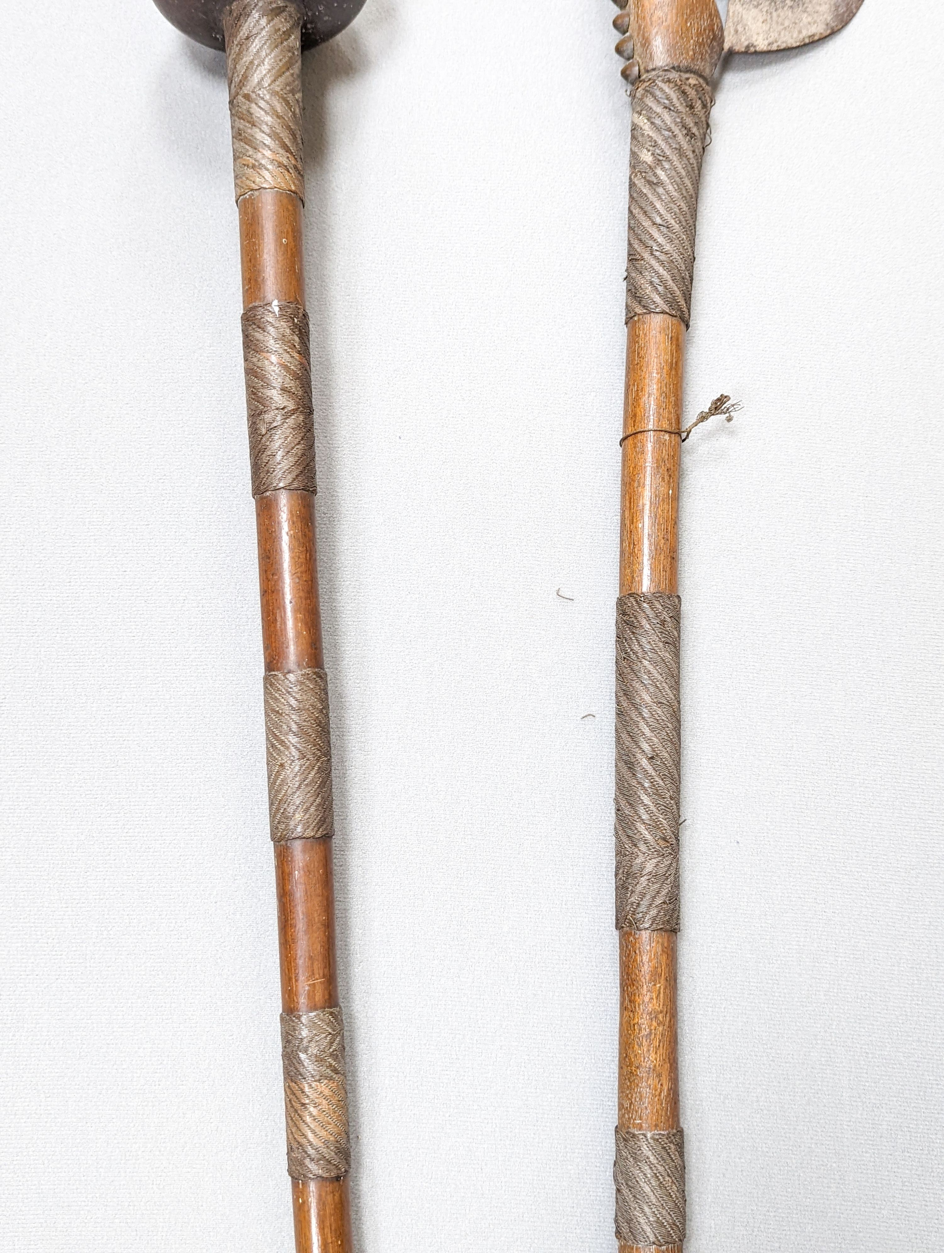 A Zulu hardwood, braided wire and studded knobkerrie and a similar axe 79cm